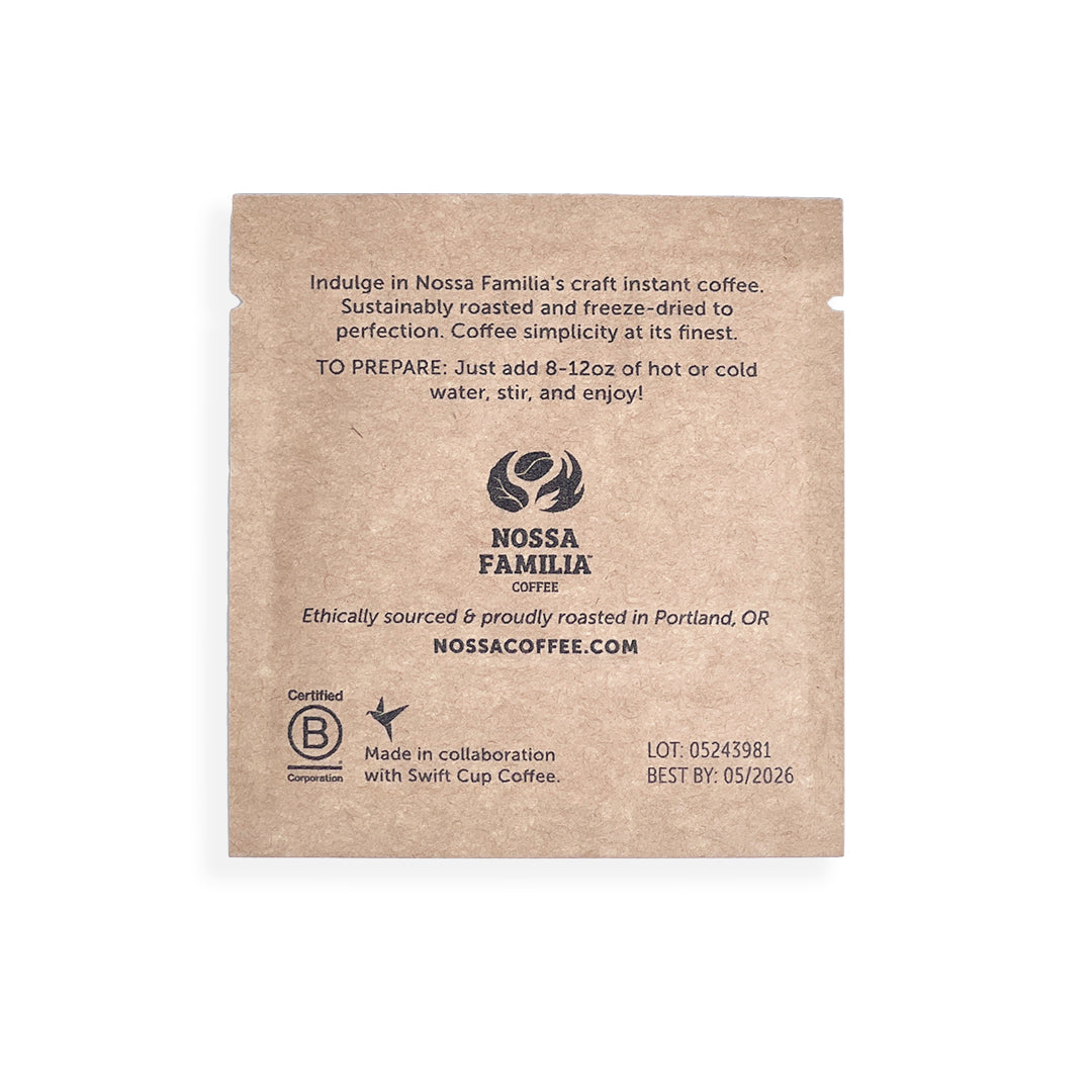 Close-up of a Nossa Familia Full Cycle instant coffee sachet package