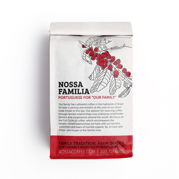 Back of a Nossa Familia coffee bag, with the coffee branch illustration and our family story